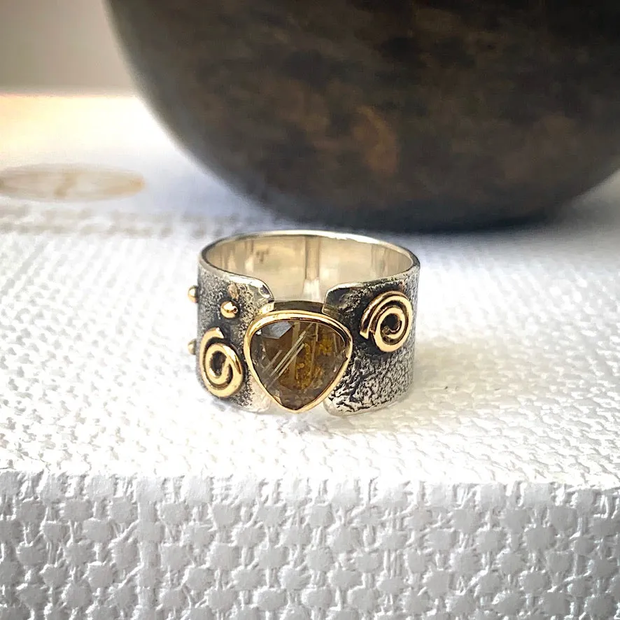 Solid sterling silver and gold ring set with incredible gold rutile quartz. Size T