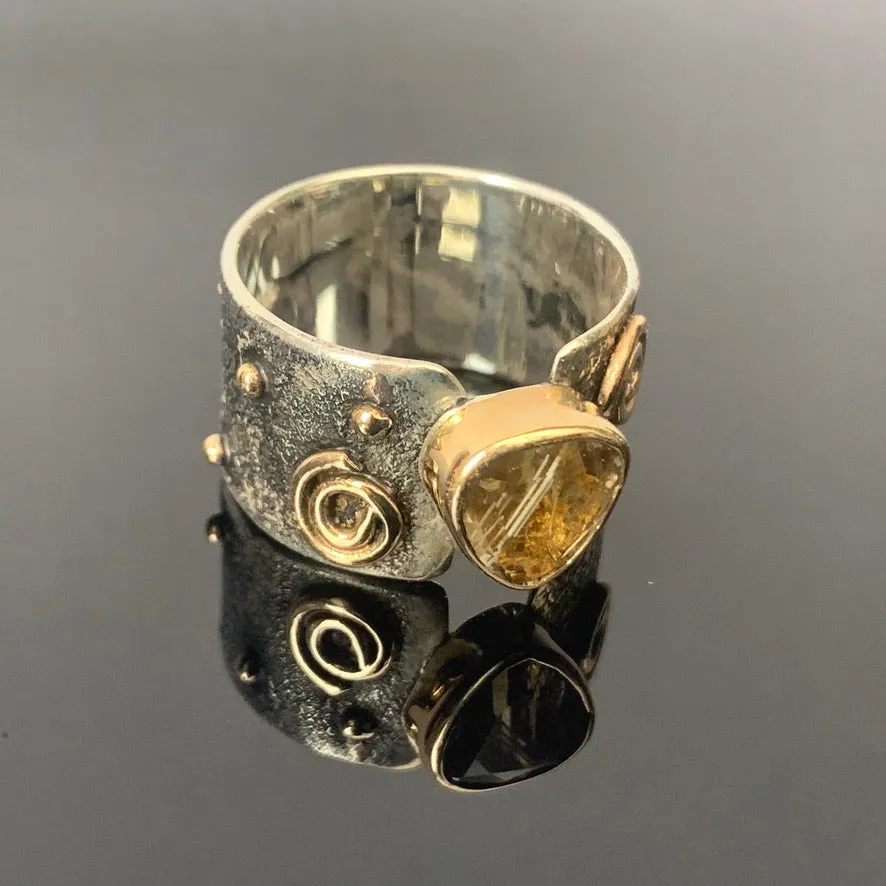 Solid sterling silver and gold ring set with incredible gold rutile quartz. Size T