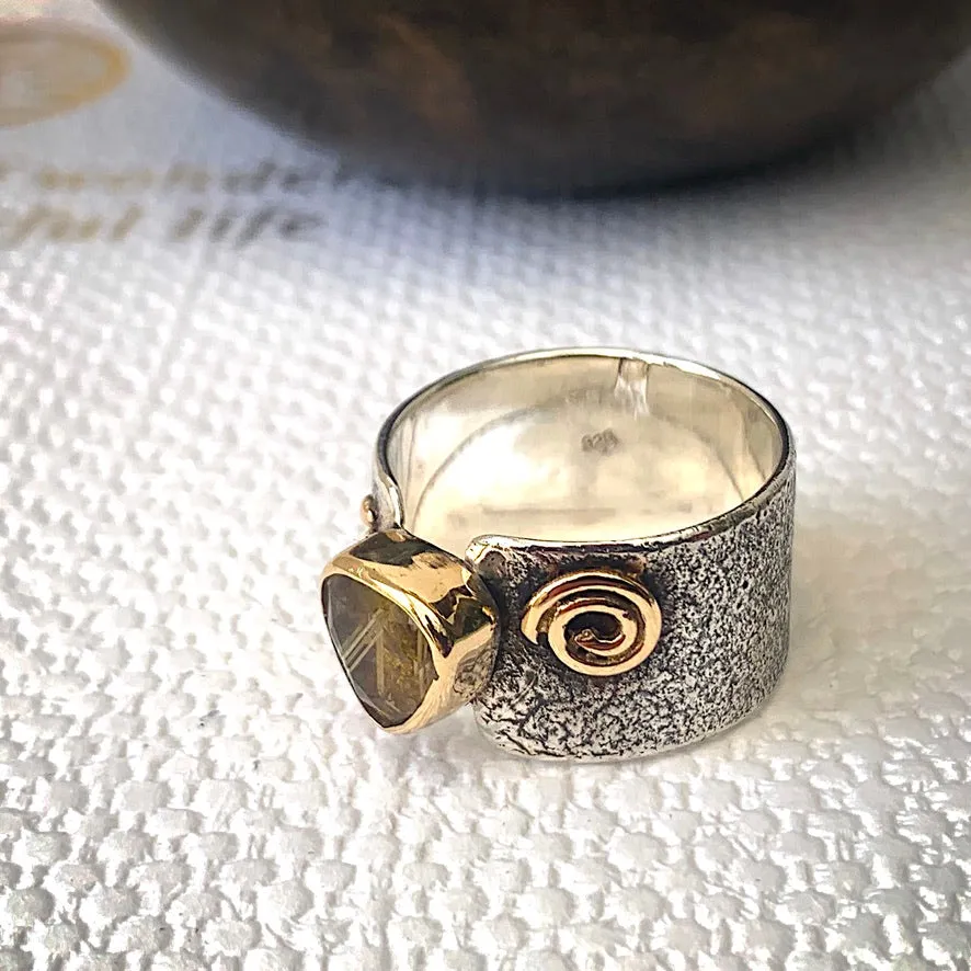 Solid sterling silver and gold ring set with incredible gold rutile quartz. Size T